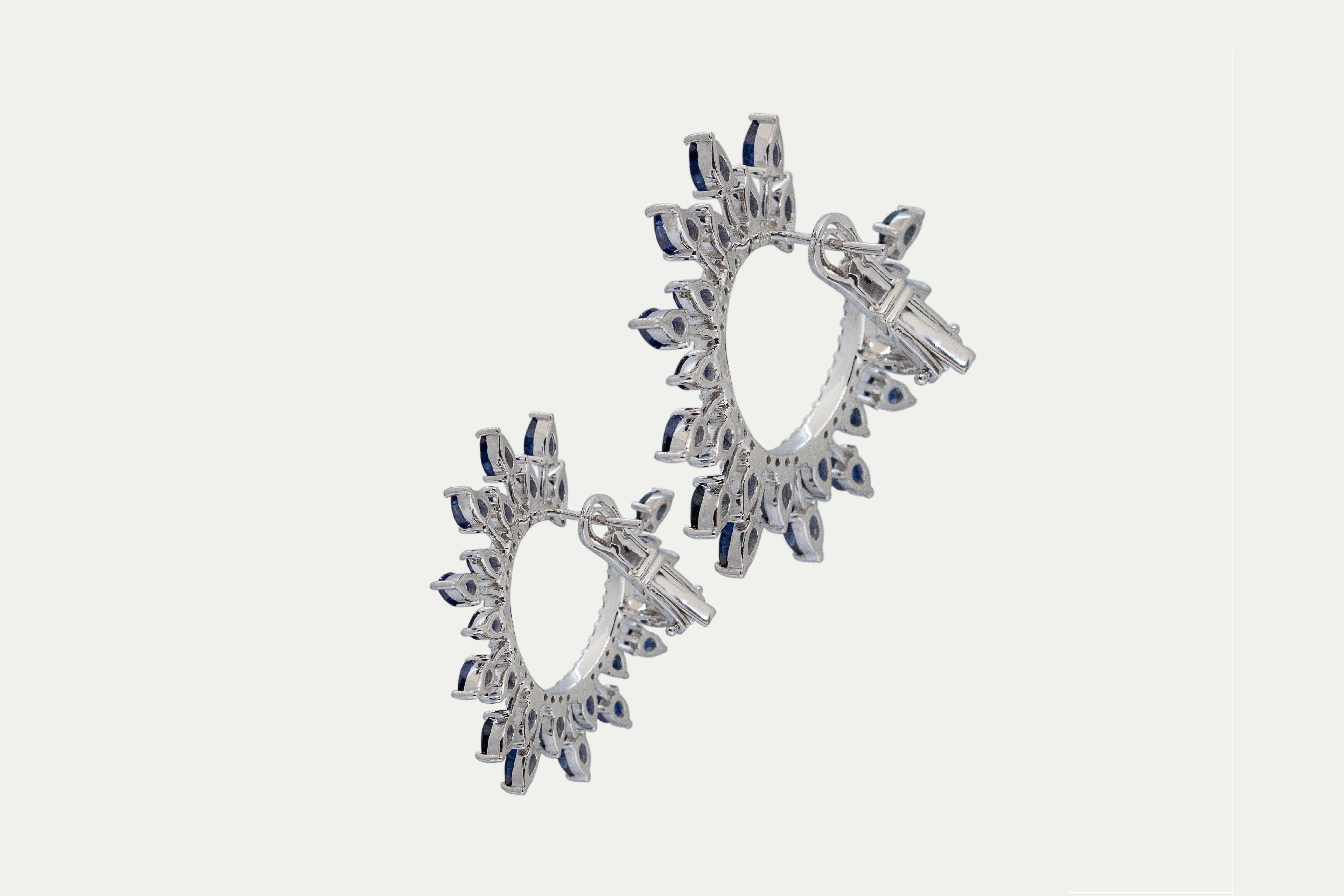 Earrings 18k white gold with 72 round diamonds, Carat total weight 0.96 and 48 blue sapphire stones, Carat total weight 10.36