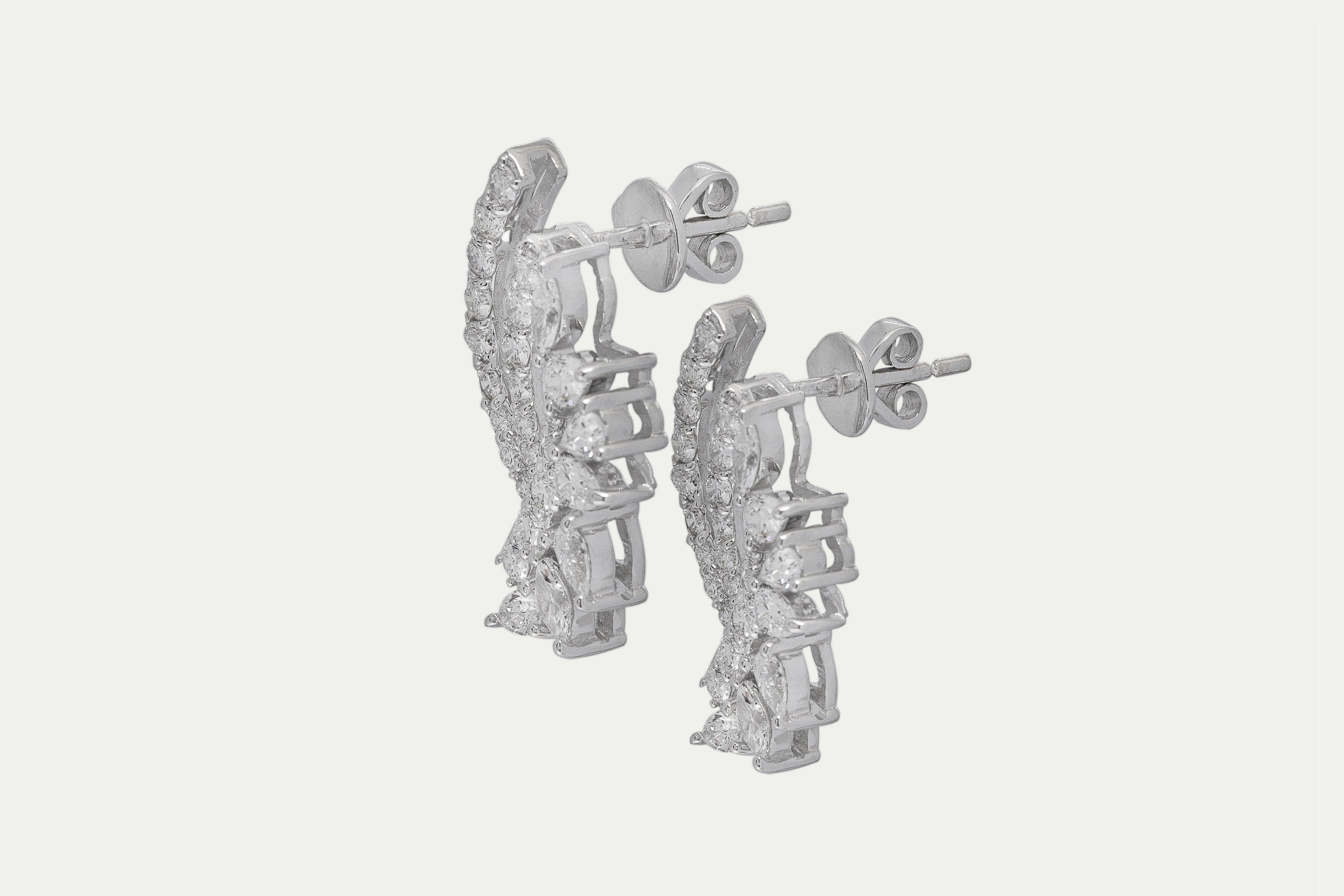 Earrings 18k white gold with 44 round diamonds, Carat total weight 0.91, 4 Marquise stones, Carat total weight 0.28 and 10 pear stones, Carat total weight 0.64